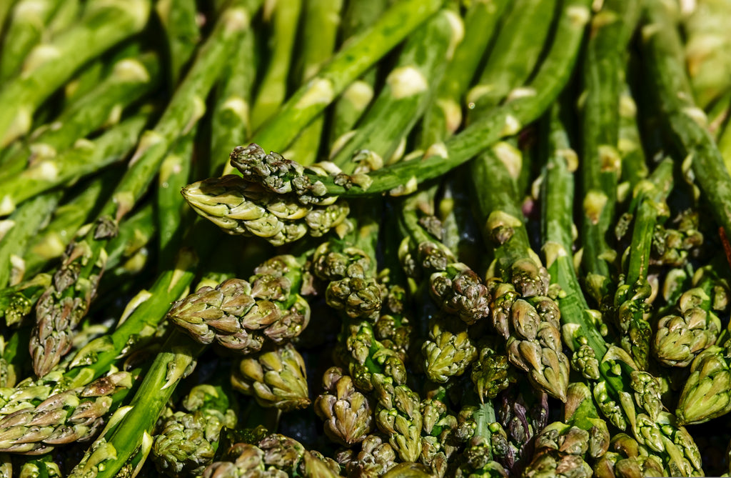 Green asparagus on a crumpled brown paper background